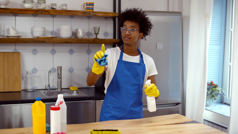 African,Professional,Janitor,Cleaning,Apartment,In,Apron,And,Rubber,Gloves.
